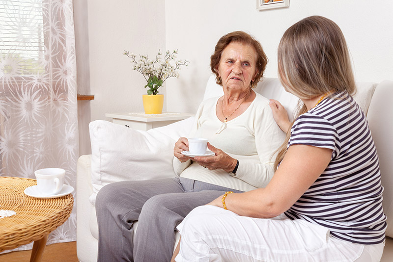 women having tea with grandma