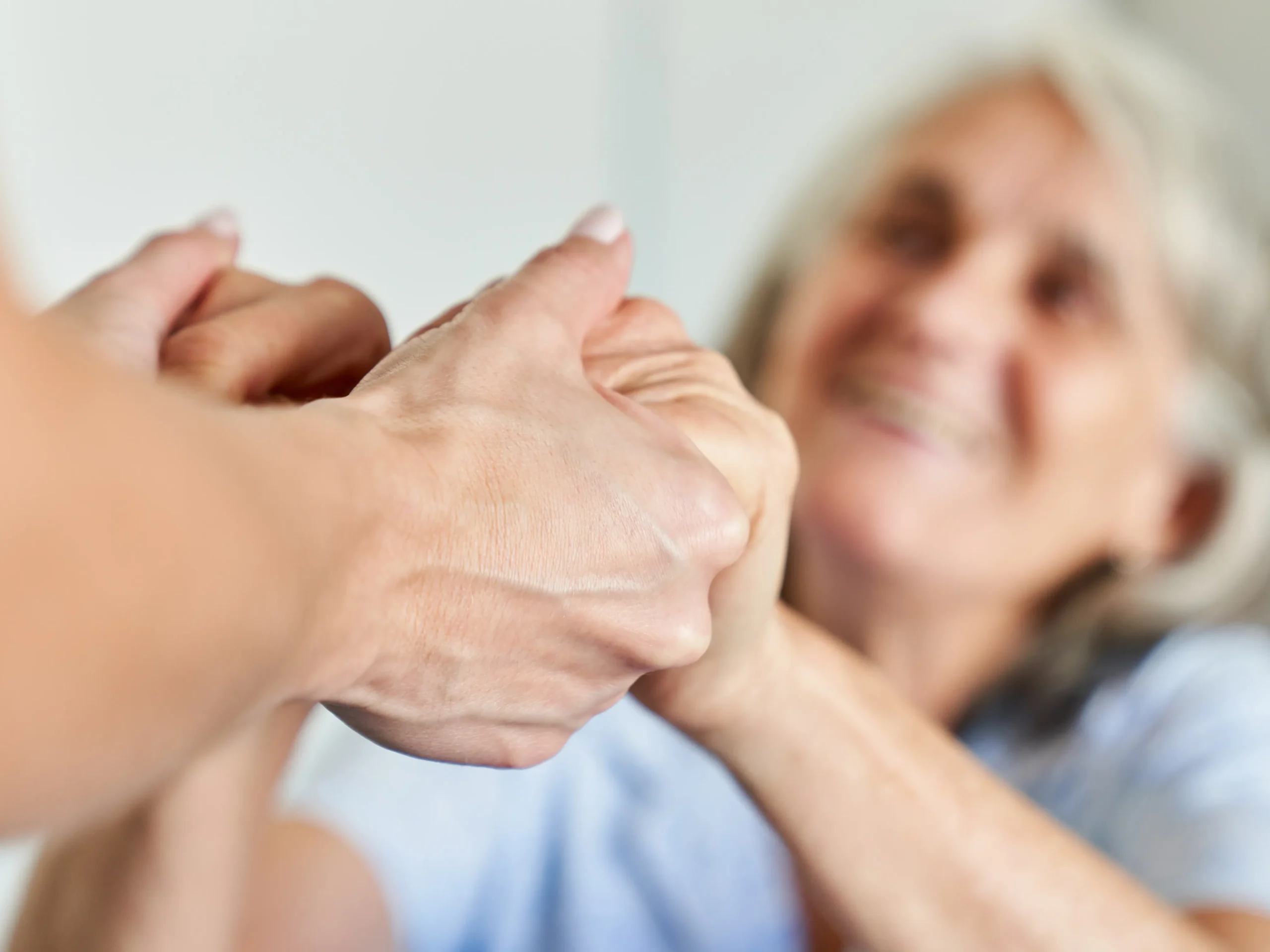 holding hands with an elderly lady