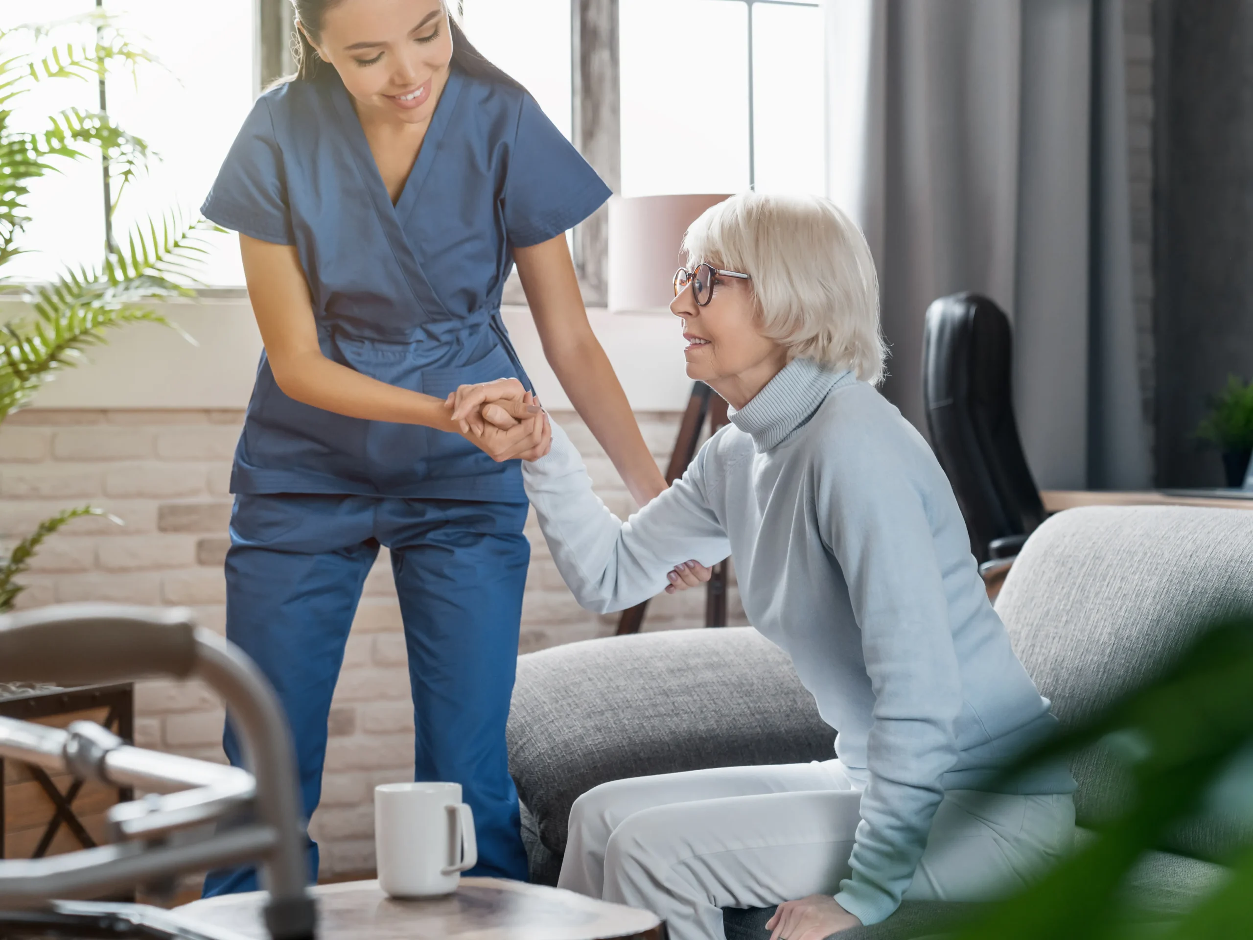 elderly woman with nurse, enjoying home health care benefits