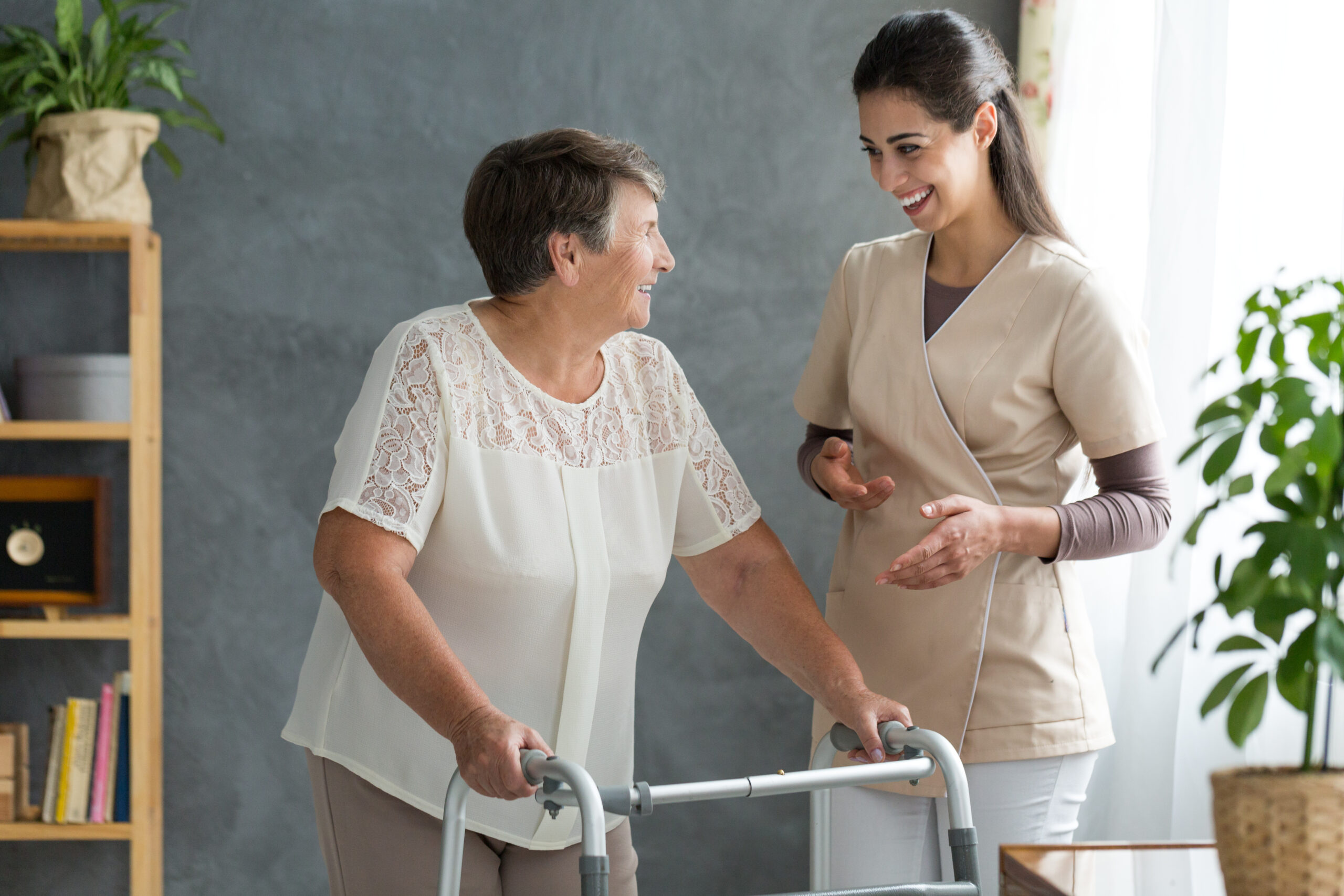 Woman with parkinson's disease chatting about the progress of her treatment with a friendly doctor